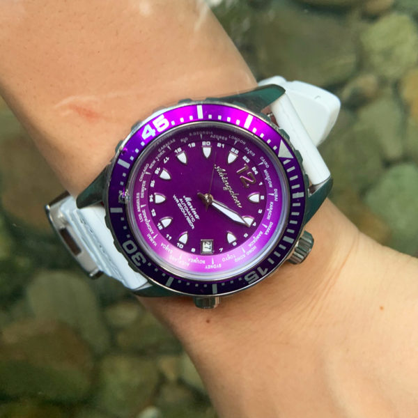 This image portrays Abingdon Watch Company - Marina Dive Watch w/ Extra Silicone Strap in Pacific Purple by Scuba Show | June 1 & 2, 2024.