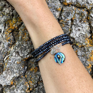 This image portrays Gogh Jewelry Design - Ocean Beauty Wrap Bracelet with Abalone by Scuba Show | June 1 & 2, 2024.